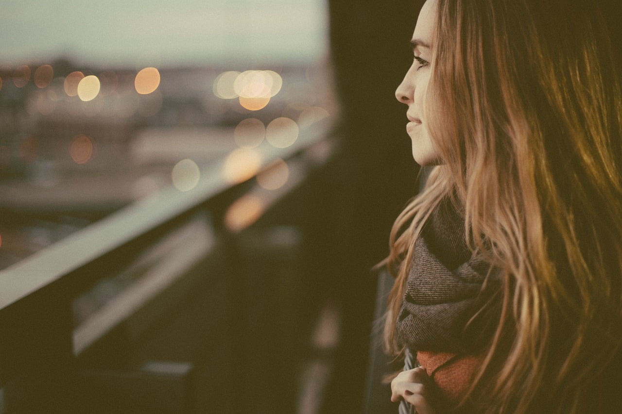 a woman looking out a window