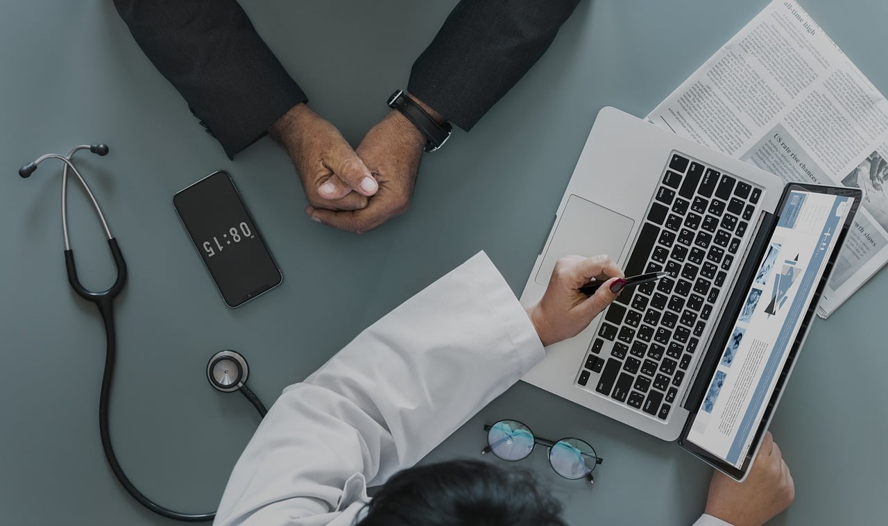 a doctor using a laptop