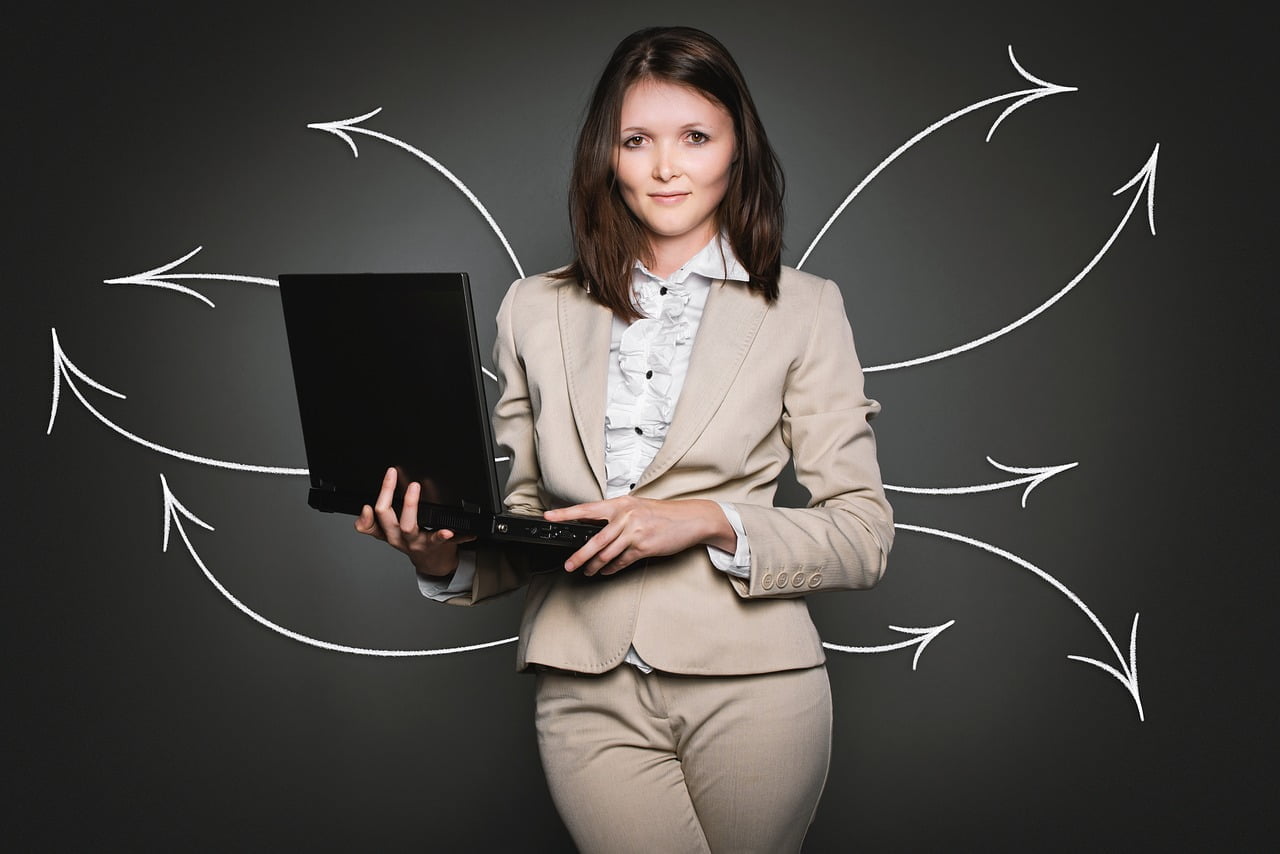 a woman holding a laptop