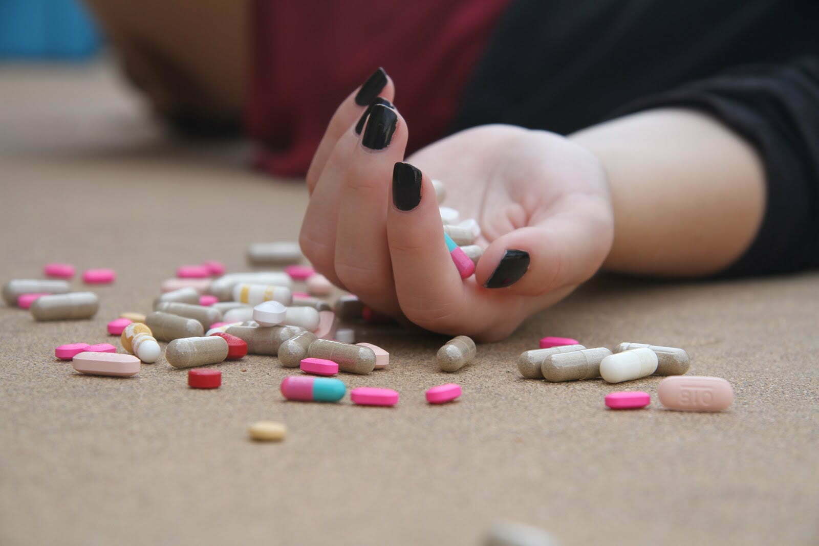a person holding a pill