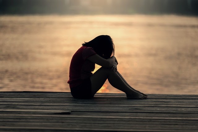 a person sitting on a bench