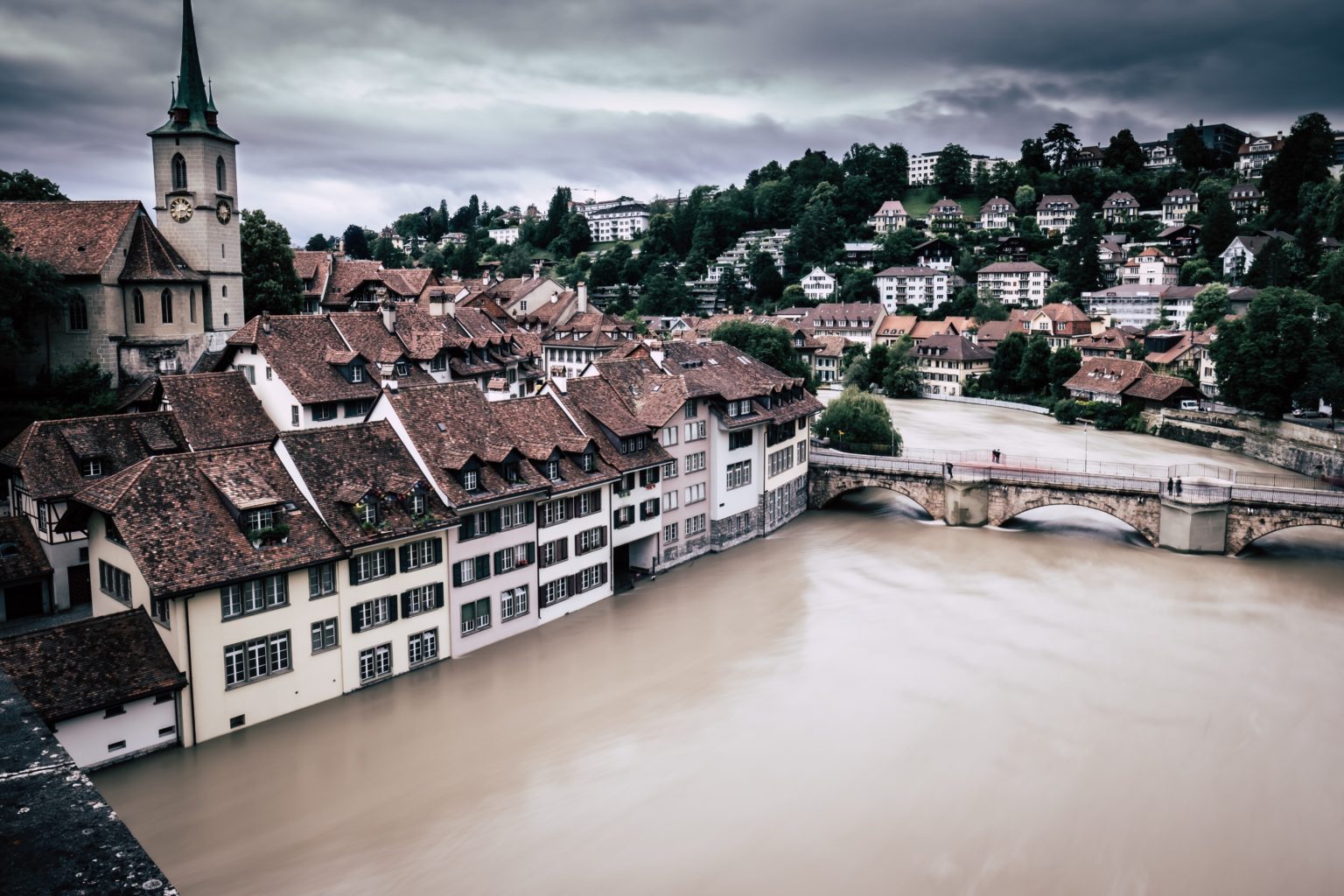 a city with a tower and a river