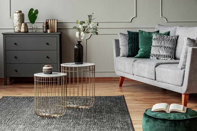 a living room with a white couch and a coffee table