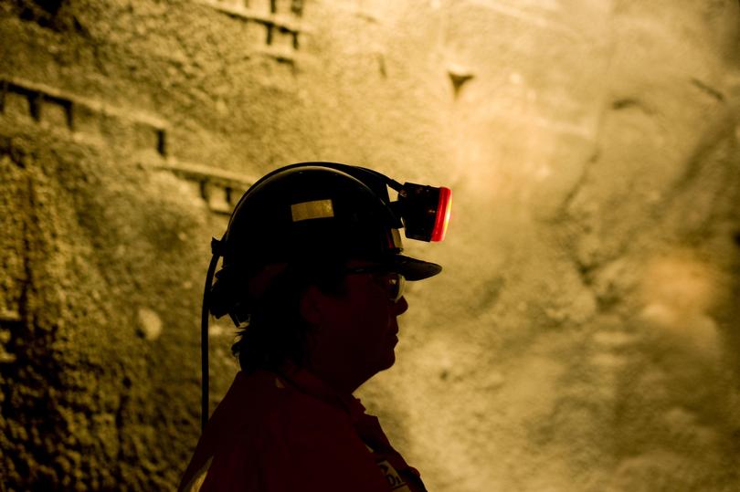 a person wearing a helmet and holding a gun