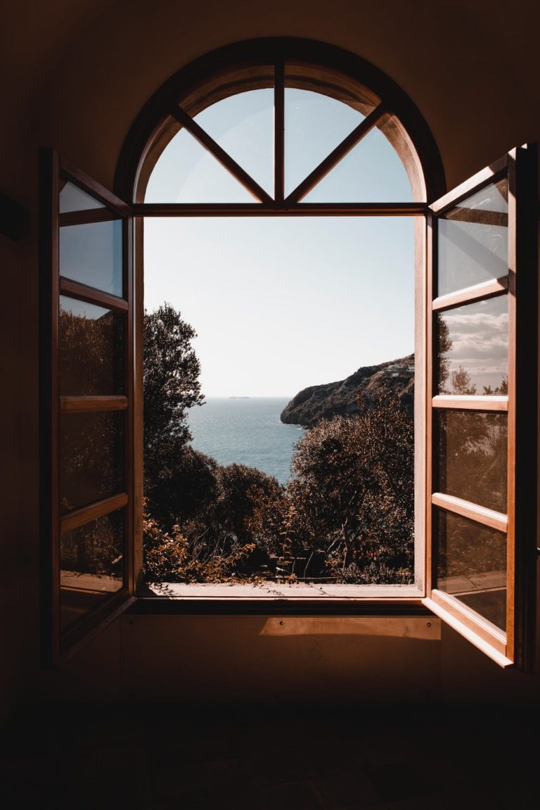 a window with a view of the ocean